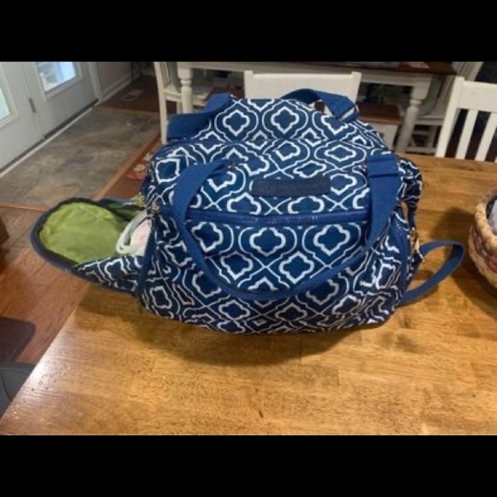 Sarah Wells Lizzy breastpump bag and pumparoo wet bag to store parts.